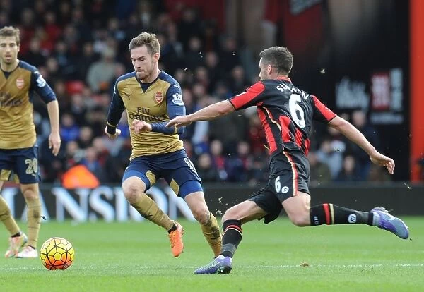 Ramsey's Powerful Surge: Arsenal's Midfield Maestro Outmaneuvers Surman in Bournemouth Clash, Premier League 2015-16
