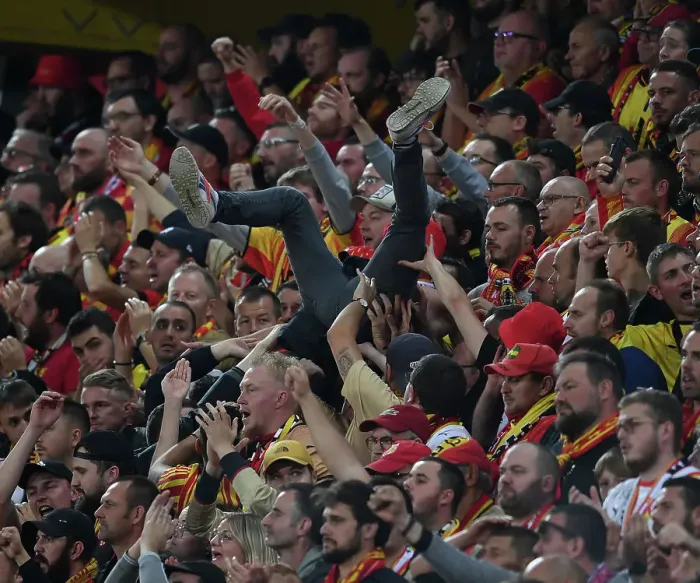 Framed Print : RC Lens vs. Arsenal: Thrilling Champions League Clash with Fan Surfing Euphoria
