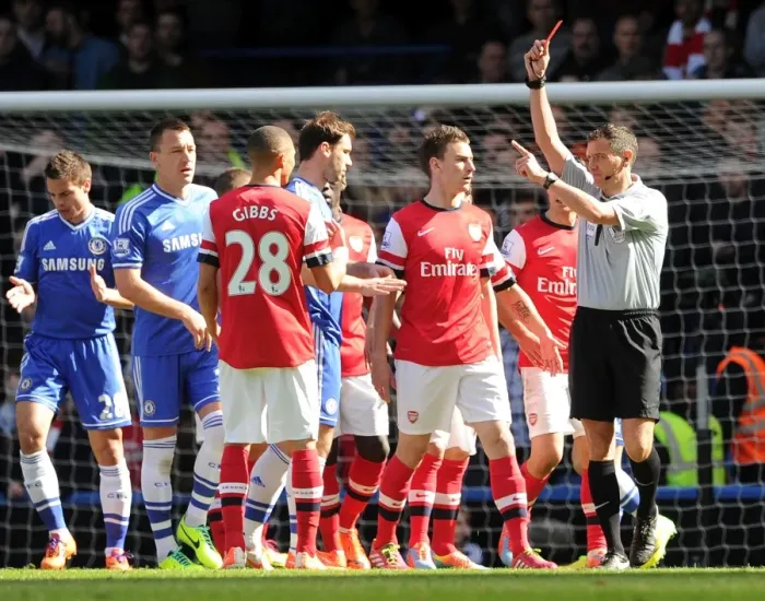 Framed Print : Red Card Drama: Gibbs Dismissed as Chelsea Edge Past Arsenal in Premier League Clash