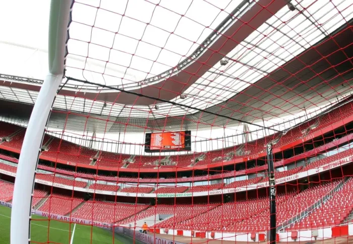Framed Print : Red Nike goalnets as part of their Lace Up Save lives charity capaign. Arsenal 1
