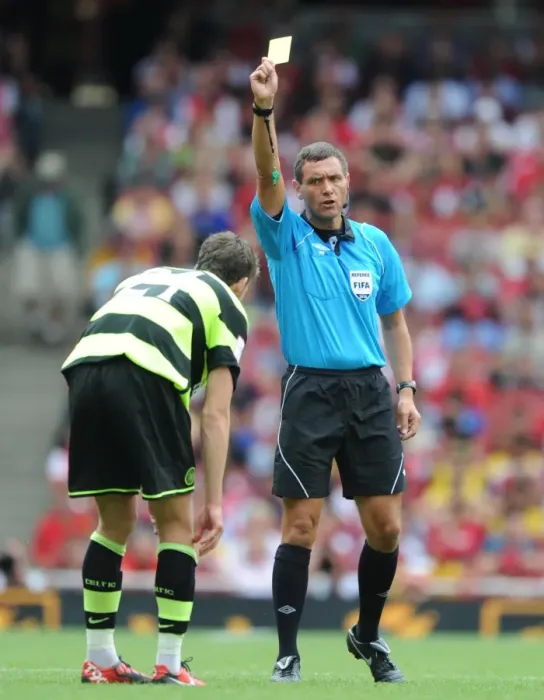 Framed Print : Referee Andre marriner shows a yellow card to Charlie Mulgrew (Celtic) Framed Print : Referee Andre marriner shows a yellow card to Charlie Mulgrew (Celtic)