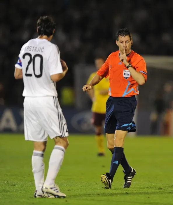 Framed Print : Referee Wolfgang Stark with Patrizan defender Mladen Krstajic. Partizan Belgrade 1