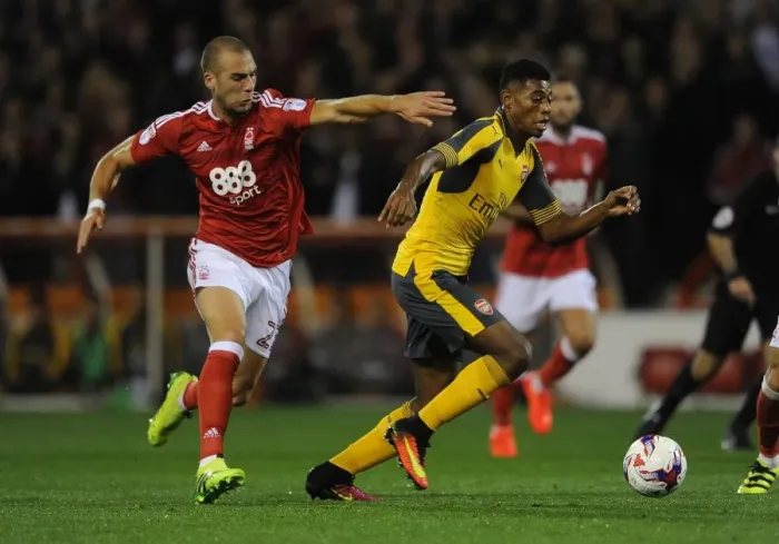 Framed Print : Reine-Adelaide vs. Kasami: A Battle in the EFL Cup Third Round between Nottingham Forest and Arsenal