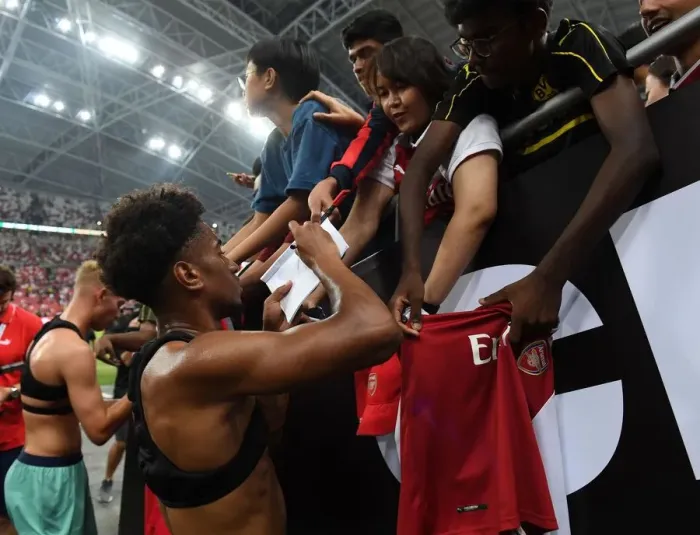 Framed Print : Reiss Nelson Greets Fans: Arsenal's Star Player Connects with Supporters after Arsenal vs. Paris Saint-Germain in Singapore (2018)