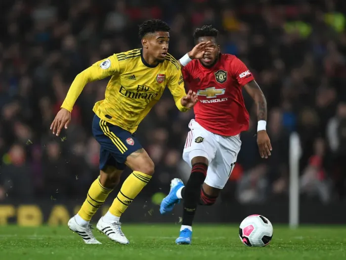 Framed Print : Reiss Nelson Outsmarts Fred: Arsenal's Young Star Outwits Manchester United's Midfielder at Old Trafford (Premier League, 2019-20)