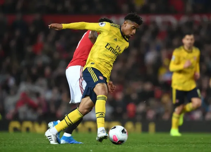 Framed Print : Reiss Nelson Outsmarts Fred: Arsenal's Triumph over Manchester United (2019-20)