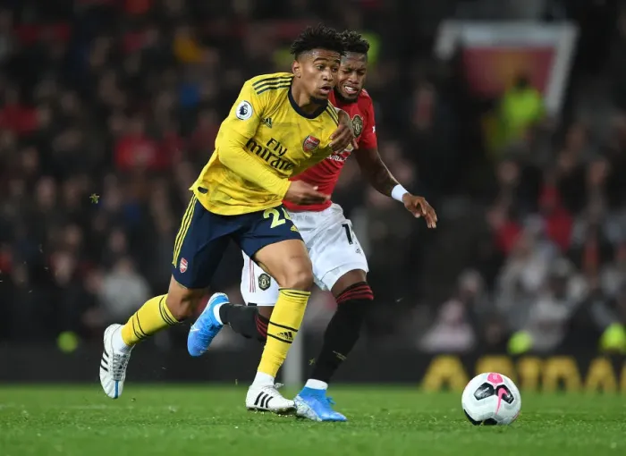 Framed Print : Reiss Nelson Outsmarts Fred: A Premier League Showdown - Manchester United vs. Arsenal (2019-20) Framed Print : Reiss Nelson Outsmarts Fred: A Premier League Showdown - Manchester United vs. Arsenal (2019-20)