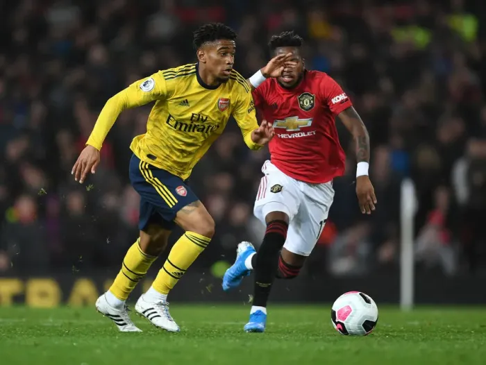 Framed Print : Reiss Nelson Outwits Fred: A Premier League Battle - Arsenal vs. Manchester United (2019-20) Framed Print : Reiss Nelson Outwits Fred: A Premier League Battle - Arsenal vs. Manchester United (2019-20)