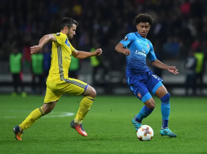 Framed Print : Reiss Nelson vs Aleksandr Volodko: Battle in the Europa League between Arsenal and BATE Borisov