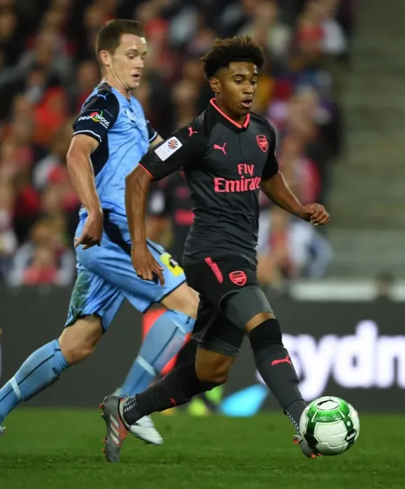 Framed Print : Reiss Nelson vs. Brandon O'Neill: A Riveting Battle in the Sydney FC vs. Arsenal Pre-Season Clash