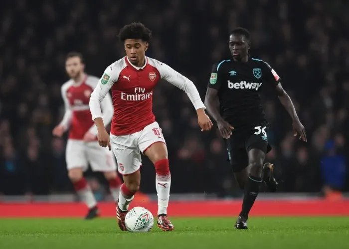 Framed Print : Reiss Nelson vs. Domingos Quina: Carabao Cup Clash at Arsenal's Emirates Stadium