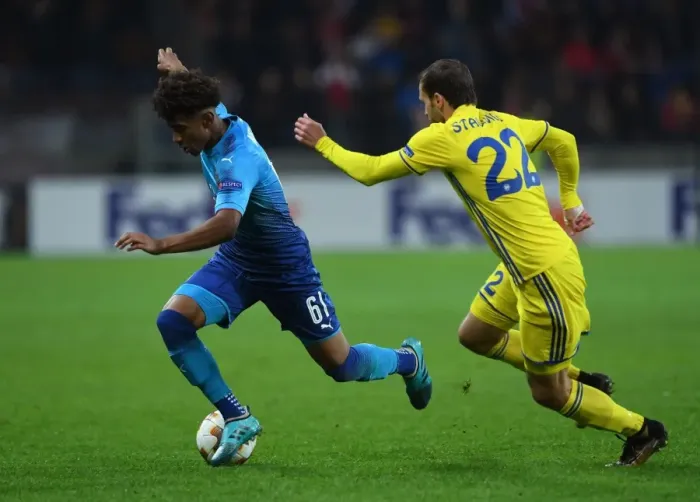 Framed Print : Reiss Nelson vs Igor Stasevich: Battle in the Europa League between Arsenal FC and BATE Borisov