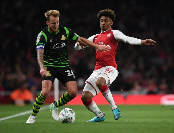 Framed Print : Reiss Nelson vs. James Coppinger: Arsenal vs. Doncaster Rovers in Carabao Cup Clash Framed Print : Reiss Nelson vs. James Coppinger: Arsenal vs. Doncaster Rovers in Carabao Cup Clash