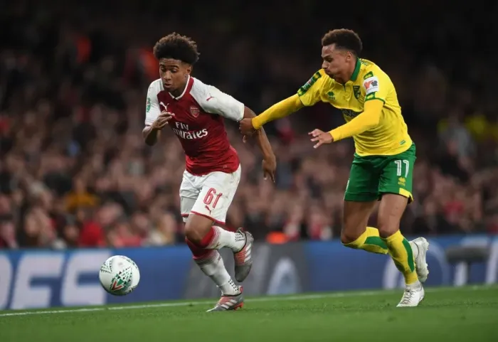 Framed Print : Reiss Nelson vs. Josh Murphy: A Battle in the Carabao Cup Clash Between Arsenal and Norwich