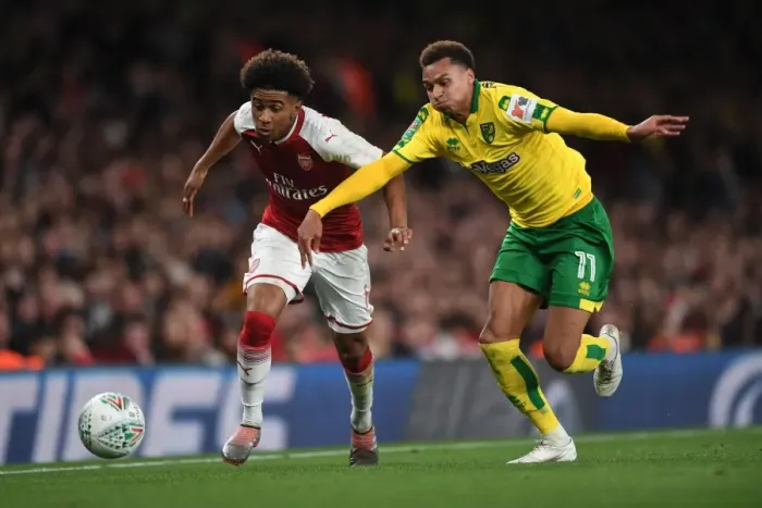 Framed Print : Reiss Nelson vs. Josh Murphy: A Carabao Cup Showdown at Arsenal's Emirates Stadium