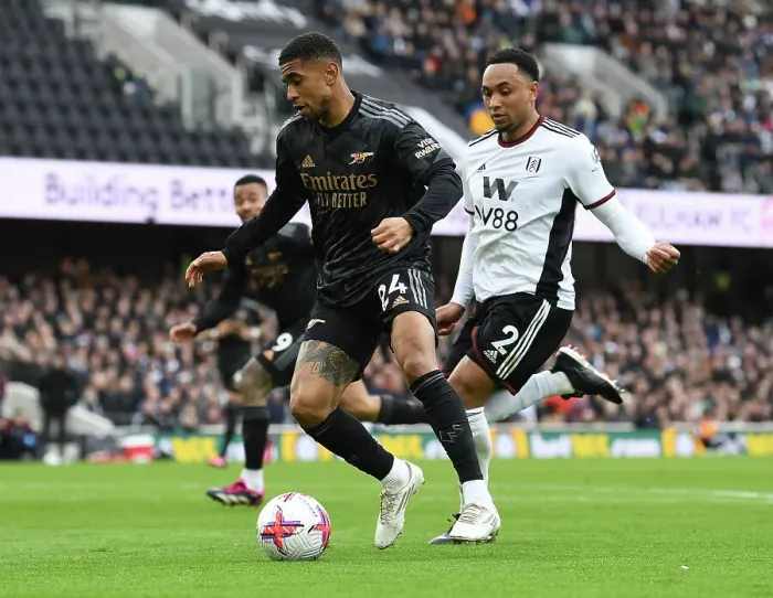 Framed Print : Reiss Nelson vs. Kenny Tete: Battle at Craven Cottage - Fulham vs. Arsenal, Premier League 2022-23