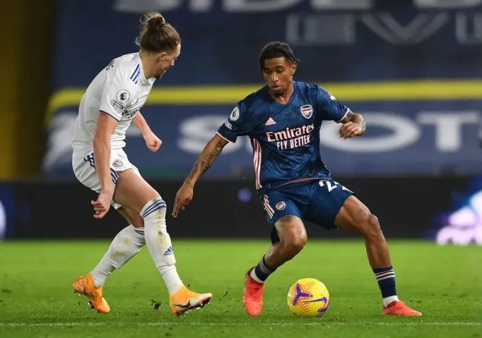 Framed Print : Reiss Nelson vs Luke Ayling: Battle at Elland Road - Leeds United vs Arsenal, Premier League 2020-21