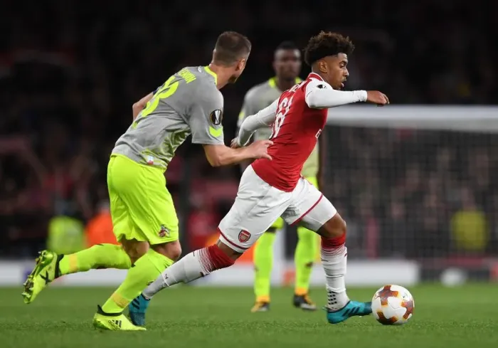 Framed Print : Reiss Nelson vs. Matthias Lehmann: Clash in the Europa League between Arsenal and 1. FC Koeln