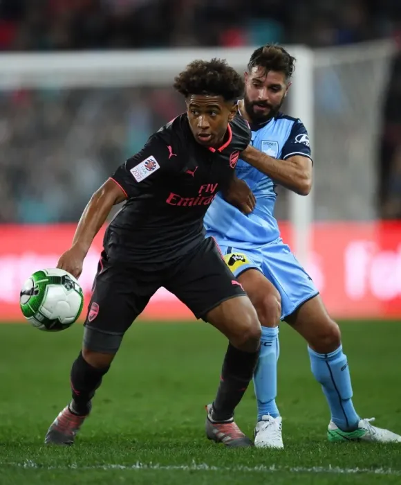 Framed Print : Reiss Nelson vs Michael Zullo: Battle at ANZ Stadium - Sydney FC vs Arsenal Pre-Season Clash