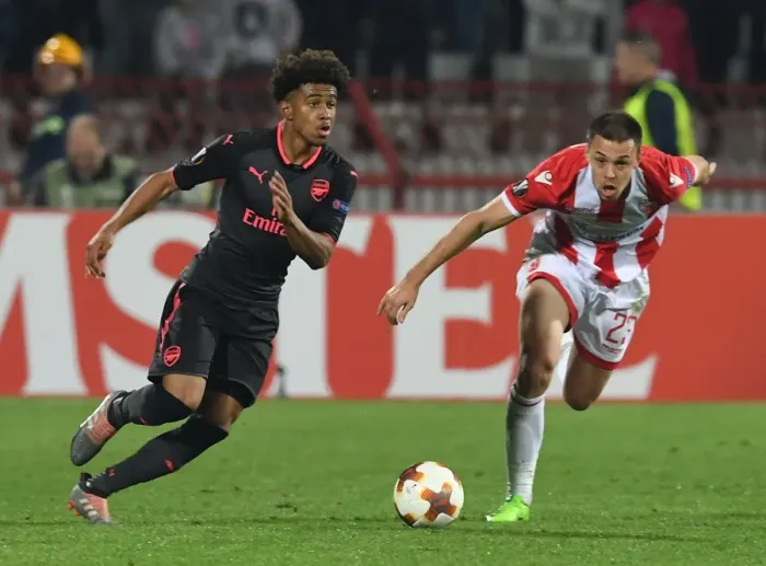 Framed Print : Reiss Nelson vs Milan Rodic: Clash in the Europa League between Crvena Zvezda and Arsenal