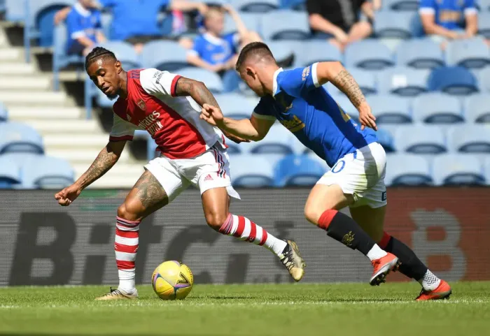 Framed Print : Reiss Nelson vs Scott Arfield: Clash at Ibrox - Rangers vs Arsenal Pre-Season Friendly