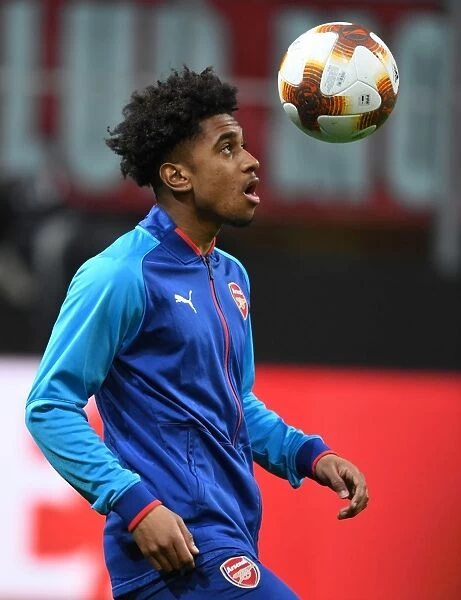 Reiss Nelson's Determined Stare: Arsenal's Rising Star Readies for AC Milan Europa League Battle