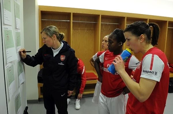 Rihanne Skinner (Assistant Manager) shows Danielle Carter and Niamh Fahey the tactics boards