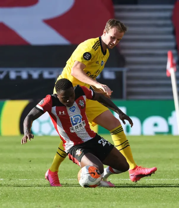 Framed Print : Rising Tensions: Holding vs. Obafemi in Southampton vs. Arsenal Premier League Clash Framed Print : Rising Tensions: Holding vs. Obafemi in Southampton vs. Arsenal Premier League Clash