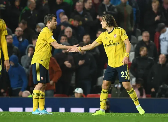 Framed Print : Rivals Unite: Sokratis and Luiz Share a Moment after United vs. Arsenal (2019-20) Framed Print : Rivals Unite: Sokratis and Luiz Share a Moment after United vs. Arsenal (2019-20)