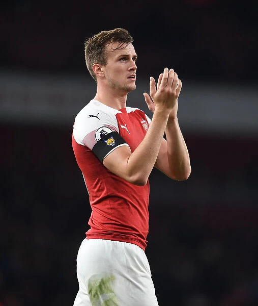 Rob Holding Celebrates with Arsenal Fans after Arsenal's Victory over Liverpool
