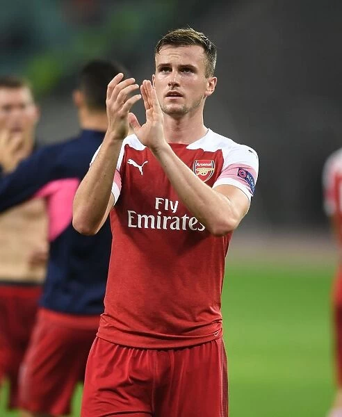 Rob Holding Celebrates with Arsenal Fans after UEFA Europa League Match against Qarabag FK