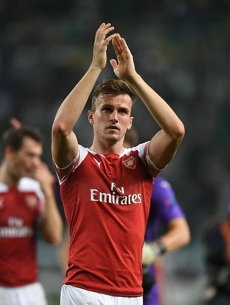 Rob Holding Celebrates with Arsenal Fans after UEFA Europa League Match vs Sporting Lisbon, 2018