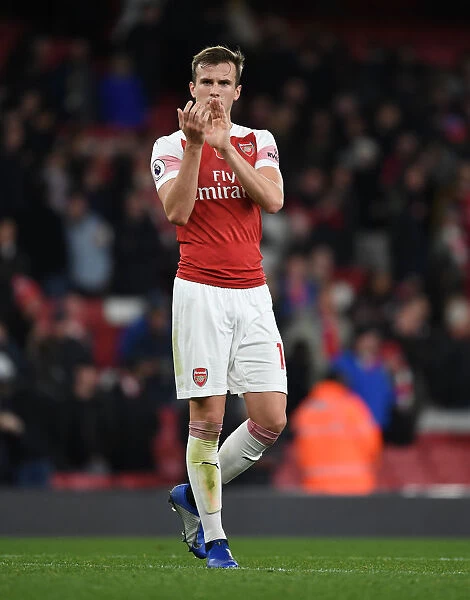 Rob Holding Celebrates with Arsenal Fans After Win Against Wolverhampton Wanderers