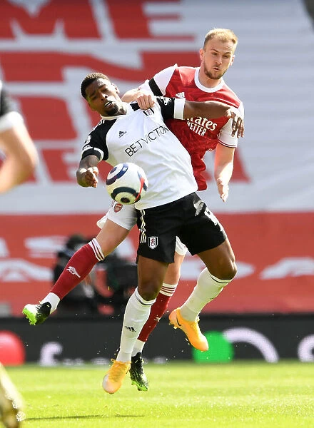 Rob Holding vs. Ivan Cavaleiro: Intense Clash at Empty Emirates in Arsenal's Premier League Battle with Fulham, 2020-21