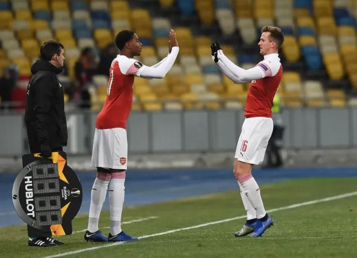 Framed Print : Rob Holding and Zech Medley: A Moment of Camaraderie in Arsenal's UEFA Europa League Match against Vorskla Poltava