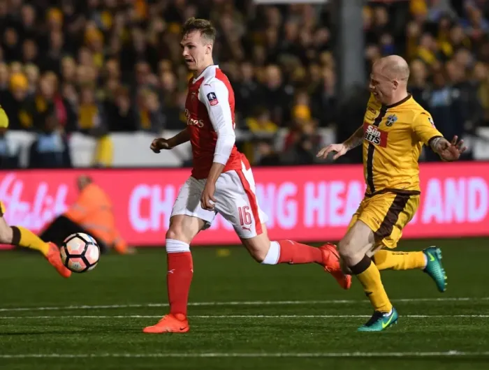 Framed Print : Rob Holding's Breakthrough: Arsenal's Shock FA Cup Victory over Sutton United