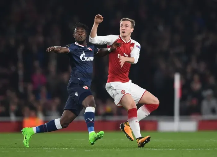 Framed Print : Rob Holding's Determined Stand Against Richmond Boakye in Europa League Clash