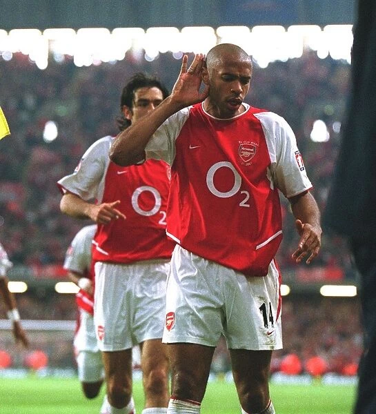 Robert Pires celebrates scoring the Arsenal goal with Thierry Henry