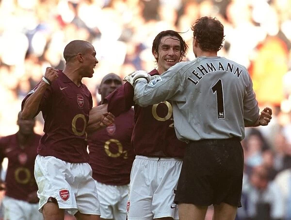 Robert Pires celebrates scoring the Arsenal goal with Gael Clichy and Jens Lehmann
