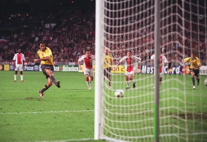 Framed Print : Robert Pires shoots past Ajax goalkeeper Hans Vonk to score the 2nd Arsenal goal from the penalty sp