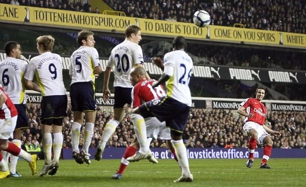 Robin van Persie (Arsenal) bends a free kick round the Tottenham wall. Tottenham Hotspur 2