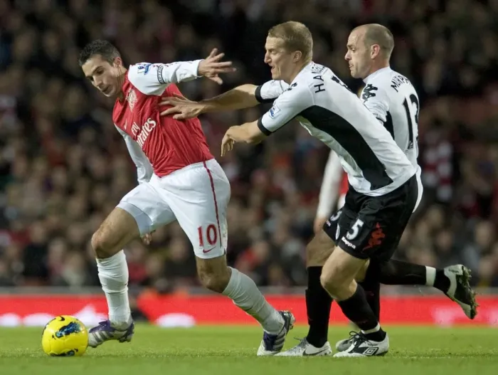 Framed Print : Robin van Persie of Arsenal breaks past Brede Hangeland of Fulham during the Barclays Premier League match between Arsenal and Fulham at Emirates Stadium on November 26, 2011 in London, England. Credit; Arsenal