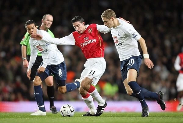 Robin van Persie (Arsenal) Jermaine Jenas and Michael Dawson (Tottenham)