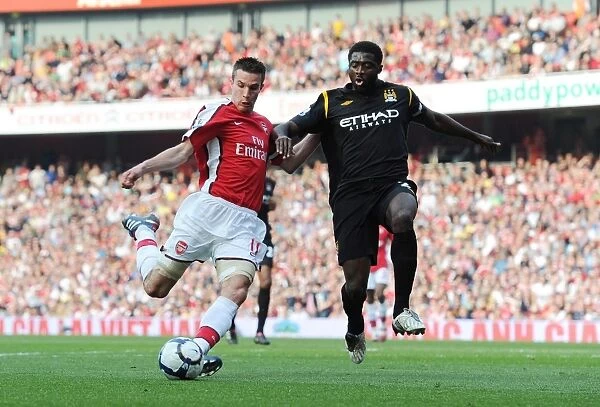 Robin van Persie (Arsenal) Kolo Toure (Man City). Arsenal 0: 0 Manchester City