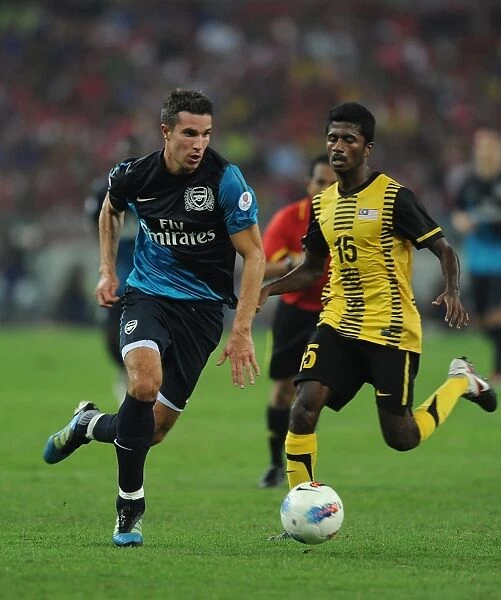Robin van Persie (Arsenal) Mohd Muslin (Malaysia). Malaysia XI 0: 4 Arsenal