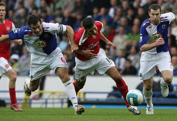 Robin van Persie (Arsenal) is pulled back by Blackburn defender Ryan Nelson
