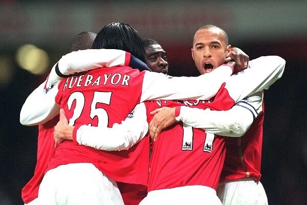 Robin van Persie celebrates scoring Arsenals 1st goal with Emmanuel Adebayor