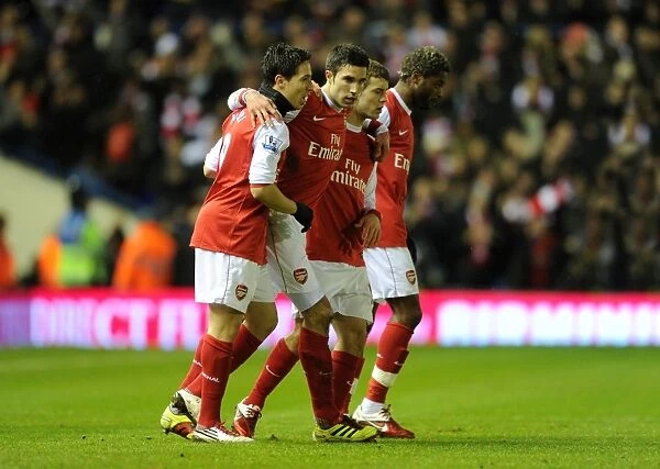 Robin van Persie celebrates scoring Arsenals 1st goal with Samir Nasri