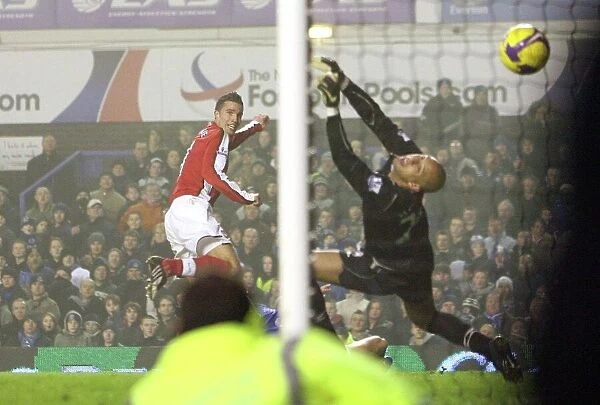Robin van Persie shoots past Everton goalkeeper Tim