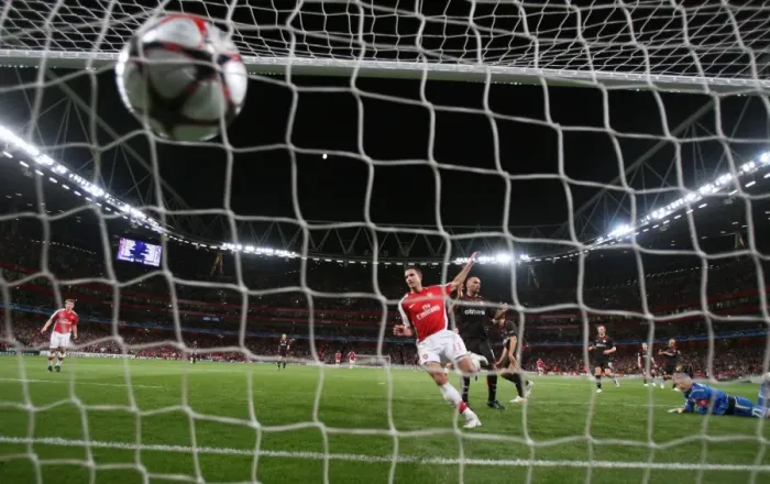 Framed Print : Robin van Persie shoots past Olypmiacos goalkeeper Framed Print : Robin van Persie shoots past Olypmiacos goalkeeper